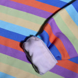 Close-up of The AG Le Happy Dance Kids’ Sweatshirt showing the colourful rainbow stripe fabric and soft fleece lining inside the sleeve.